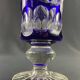 Tubular vase on a pedestal in cut blue Bohemian crystal.