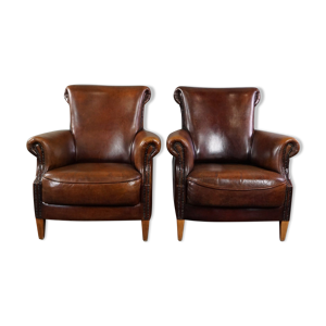Lot de 2 fauteuils en - peau