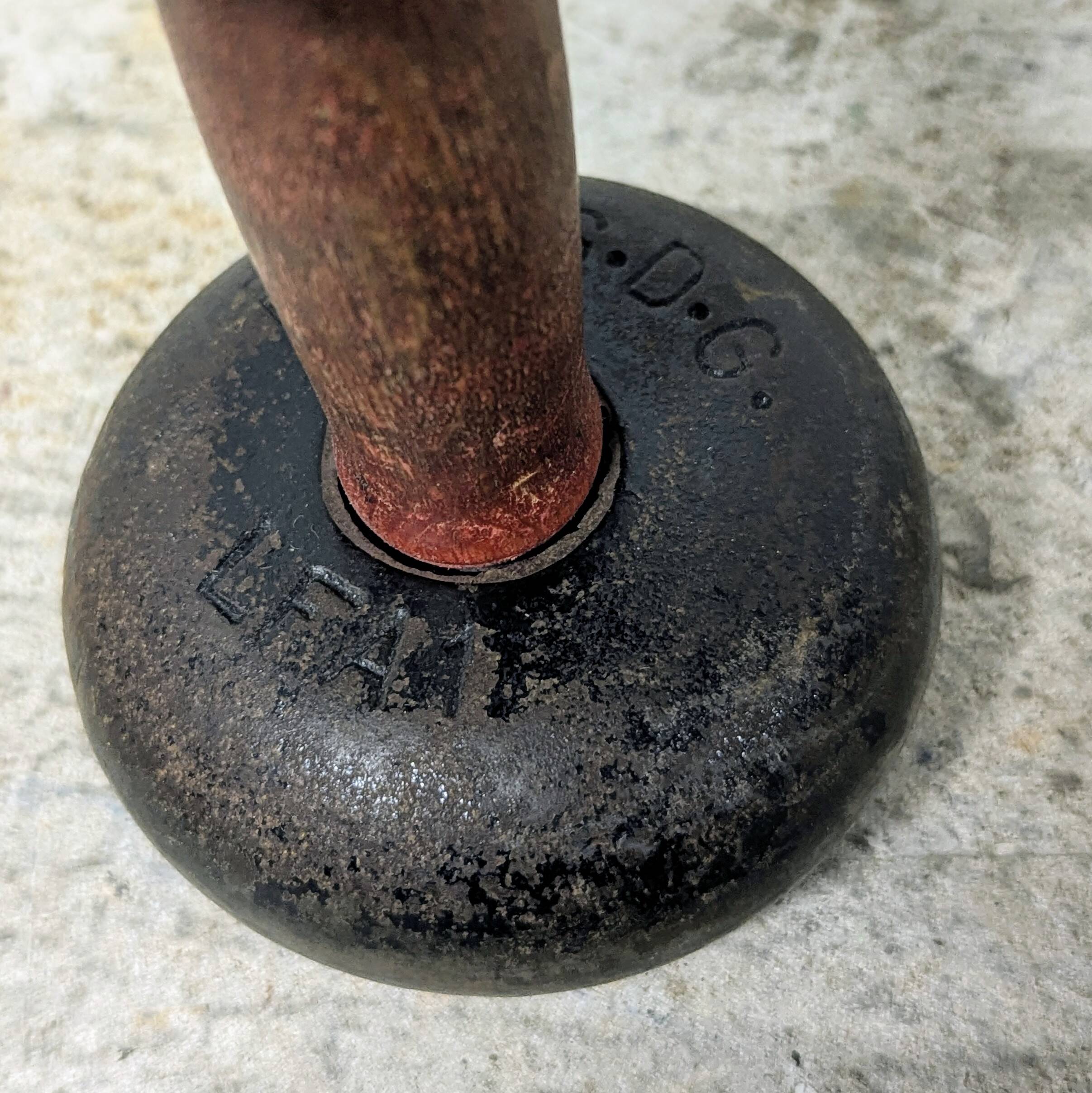 Pair of vintage cast iron and wood dumbbells