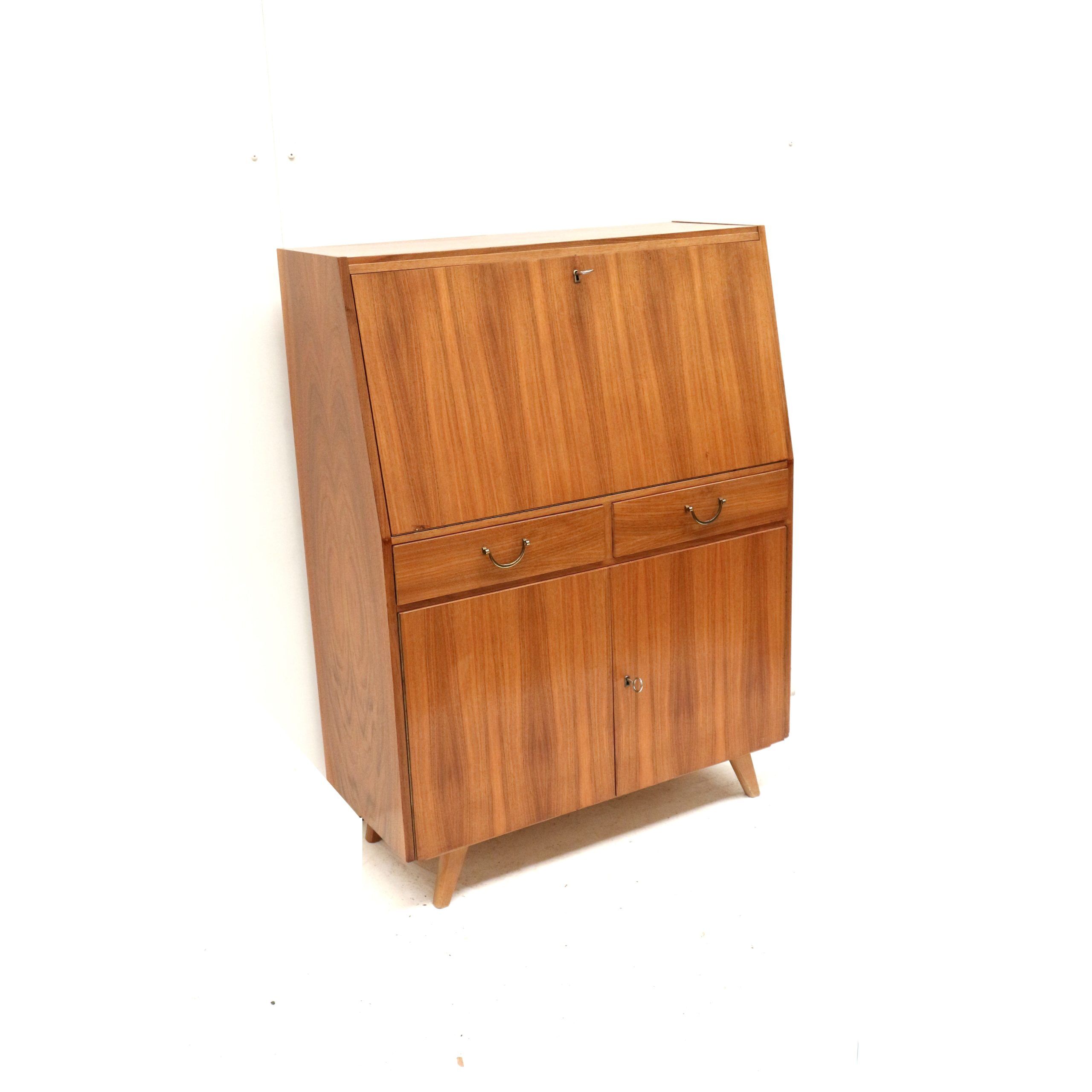 Vintage secretary with drawers, drop-down and doors from the 1960s.
