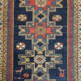 Antique tissé à la main - Tapis persan à fond bleu avec des figures ressemblant à des oiseaux