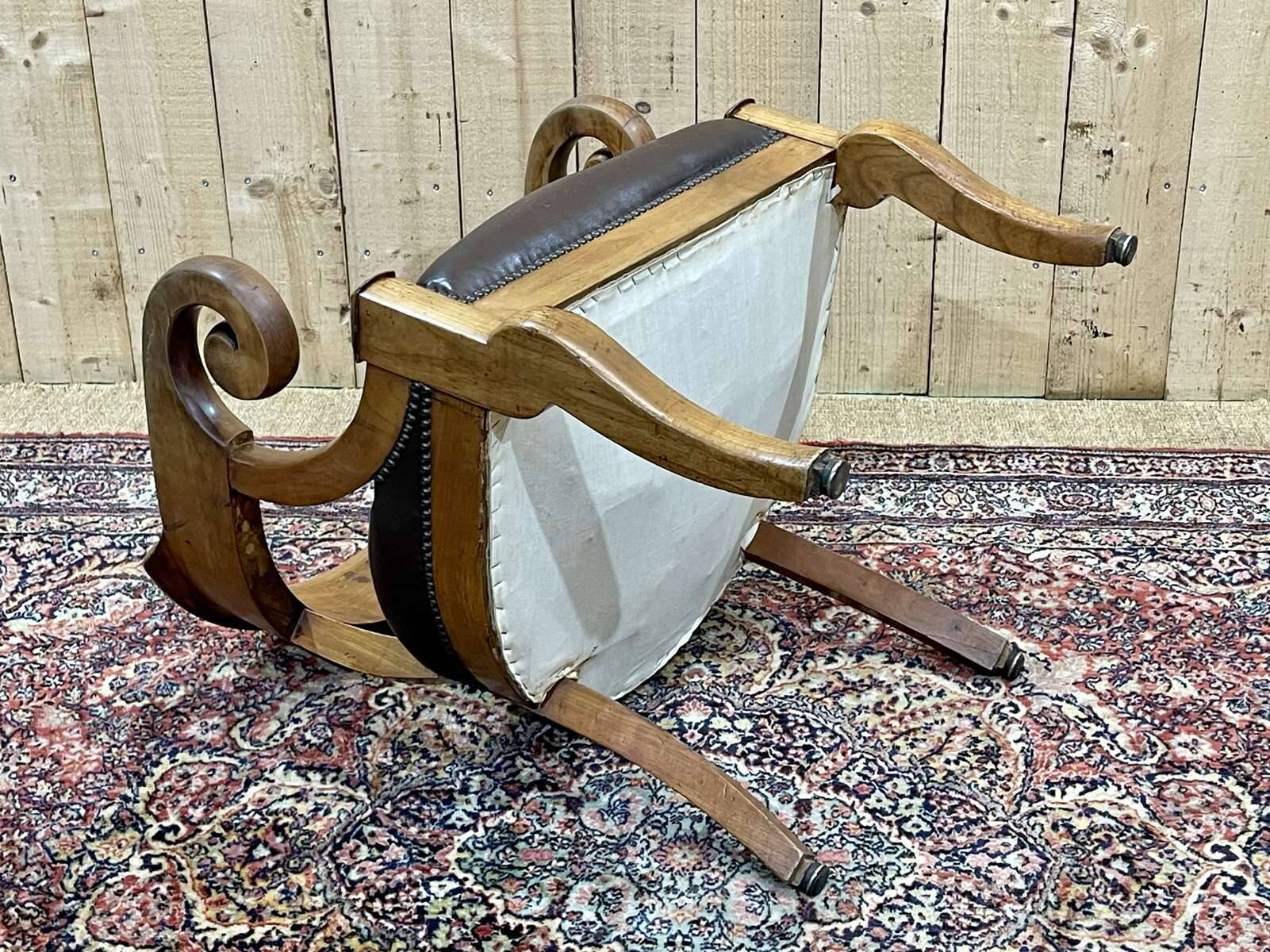 19th century French armchair in cherry wood and leather seat