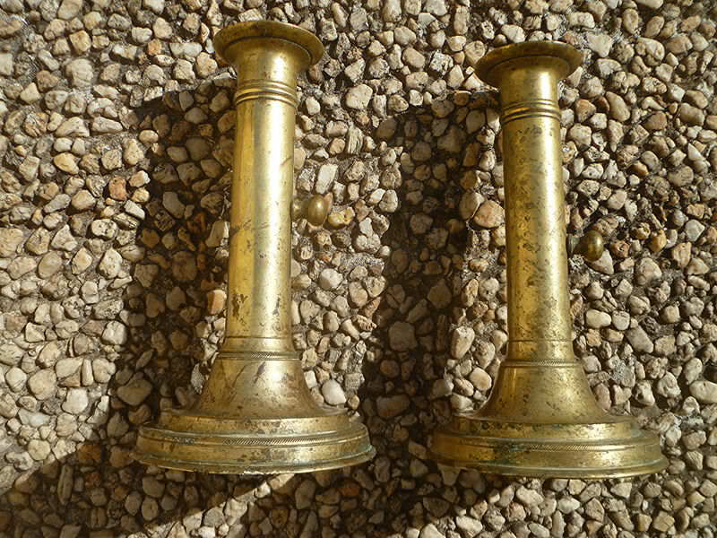 Pair of candlesticks a push brass