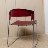 Red plastic-seat stacking chair with chrome frame by Paolo Favaretto for Assisa (Italy 1986) – vintage design