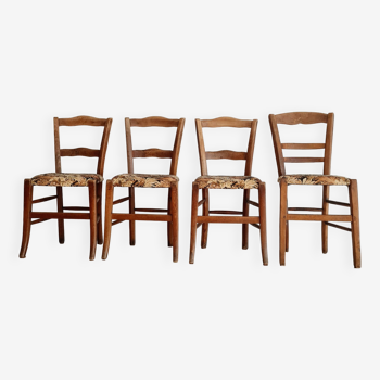 Antique wooden chairs with flowered seats