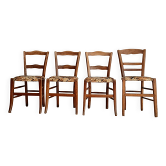 Antique wooden chairs with flowered seats