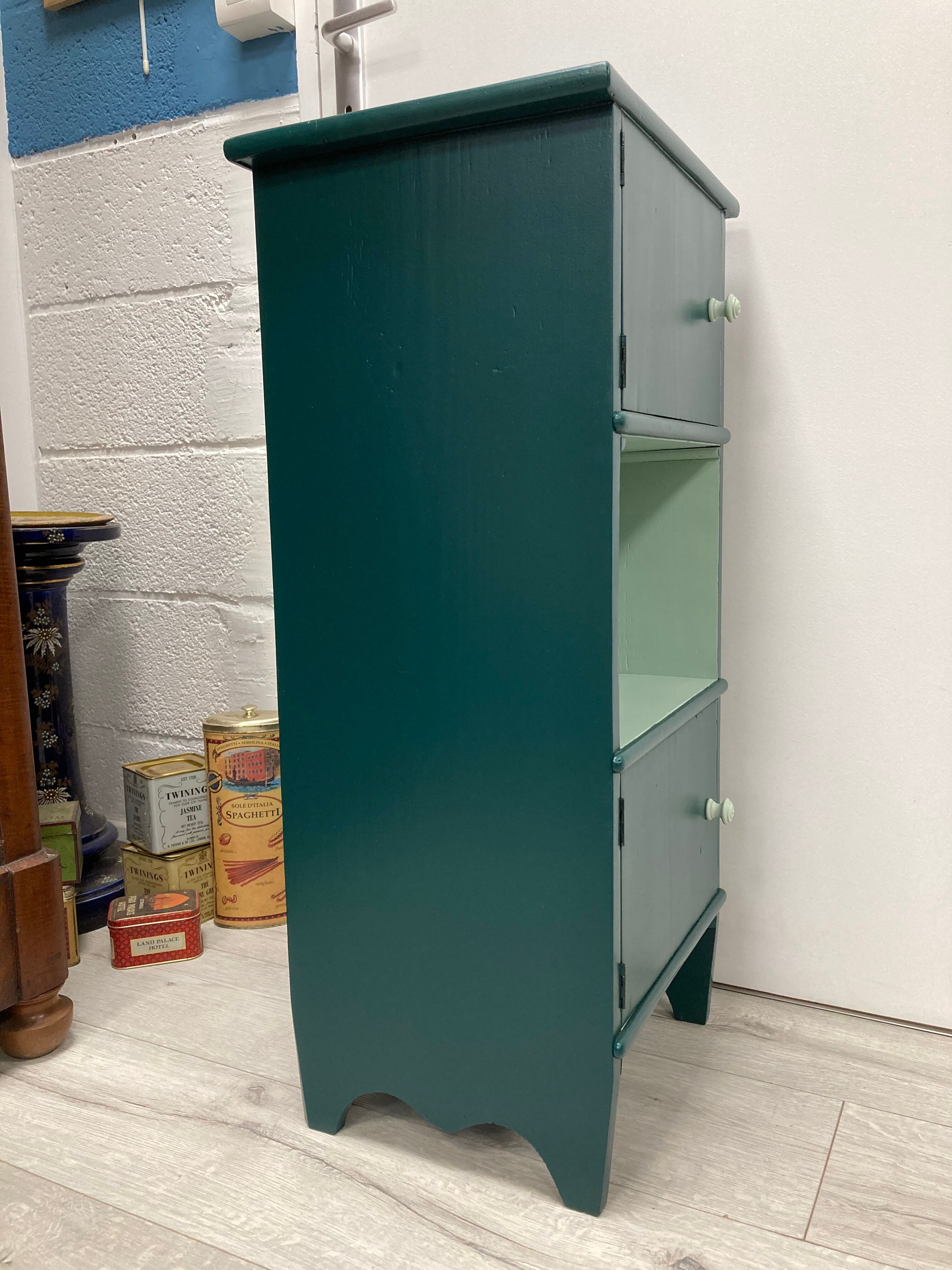 Two-door green bedside table