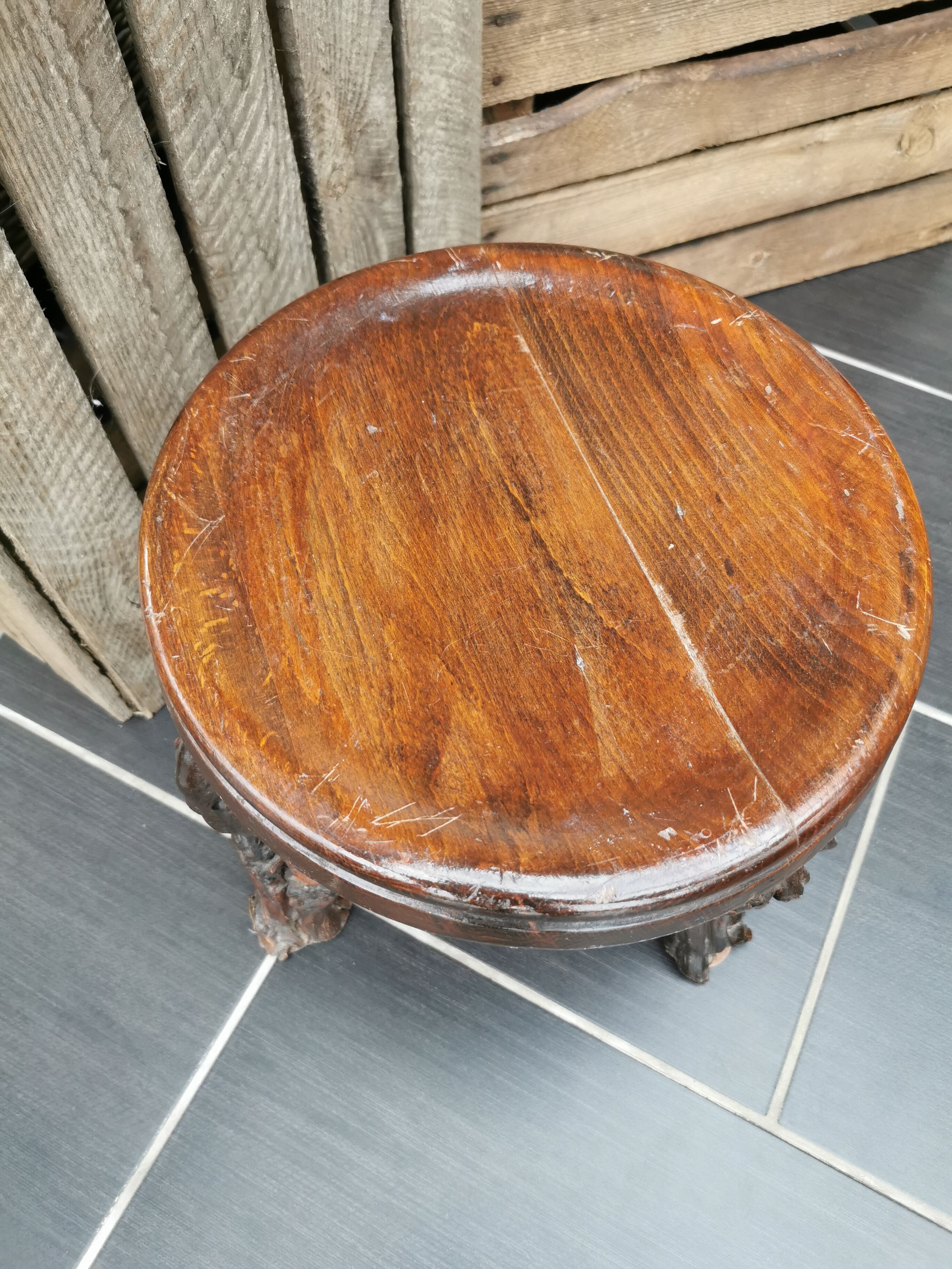 Artisan tripod stool in vines