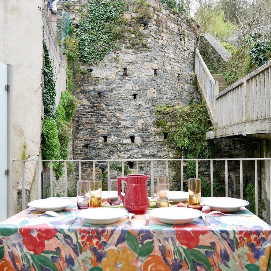 Burgundy/red ceramic pitcher