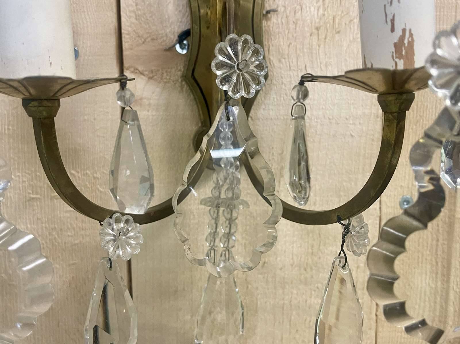 Pair of bronze sconces and pendants from the early 20th century