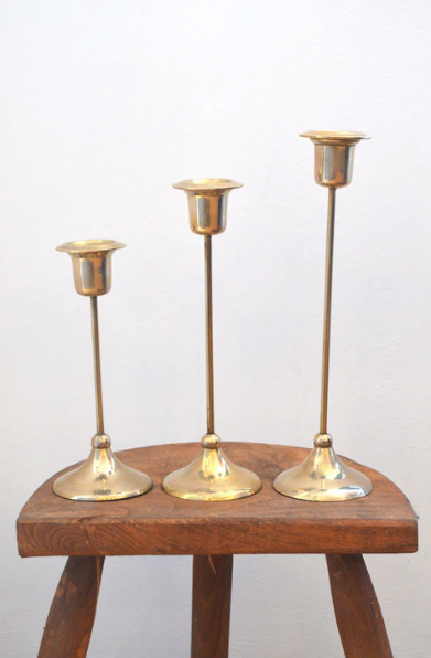 Trio of brass candlesticks