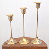 Trio of brass candlesticks
