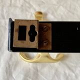 Vintage coat rack in lacquered metal with three golden aluminum hooks