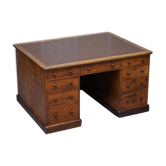 Antique Victorian oak kneehole desk with 18 double-sided drawers.