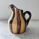 Striped decorative pitcher signed