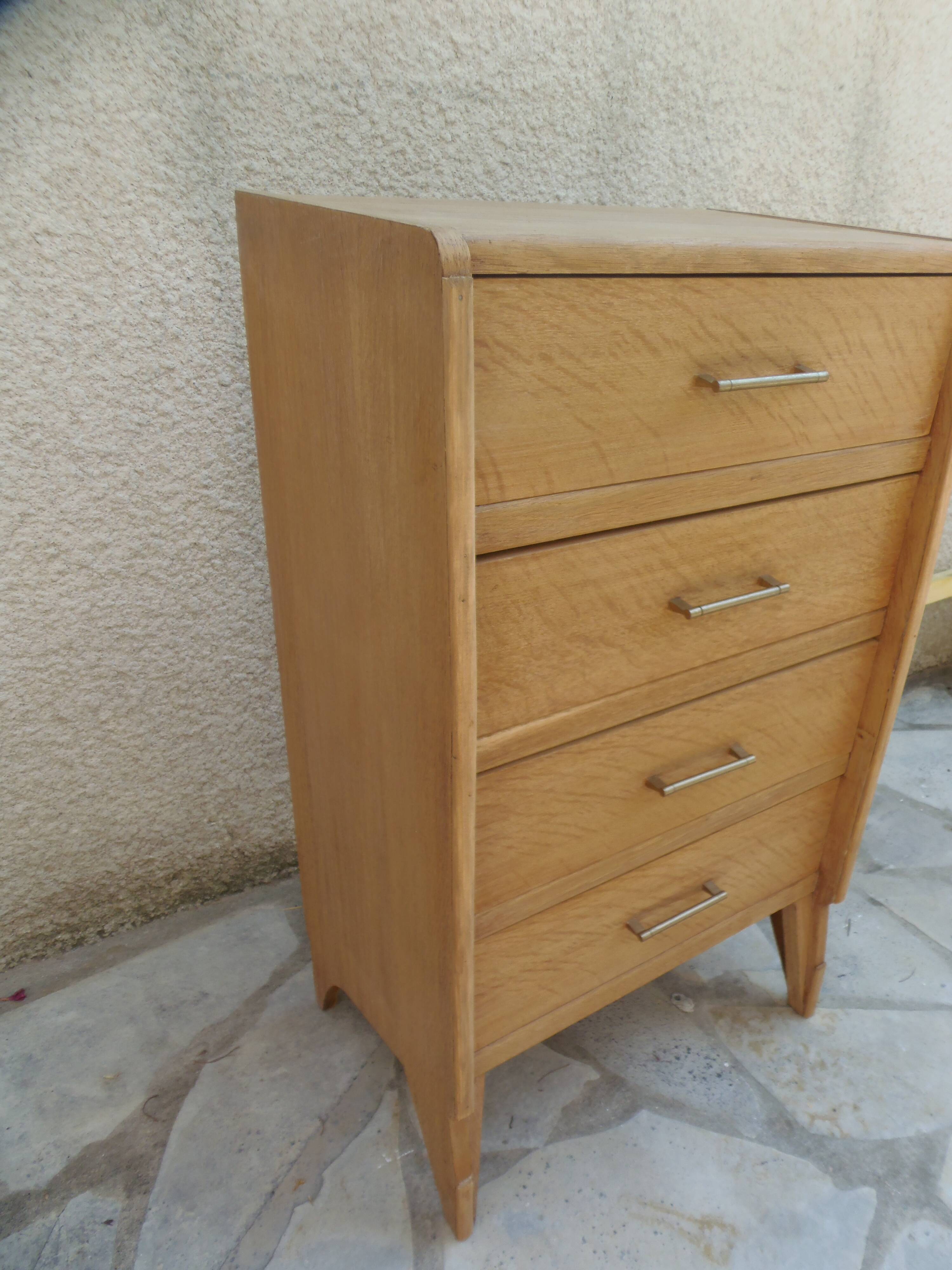 Vintage chest of drawers in raw wood.