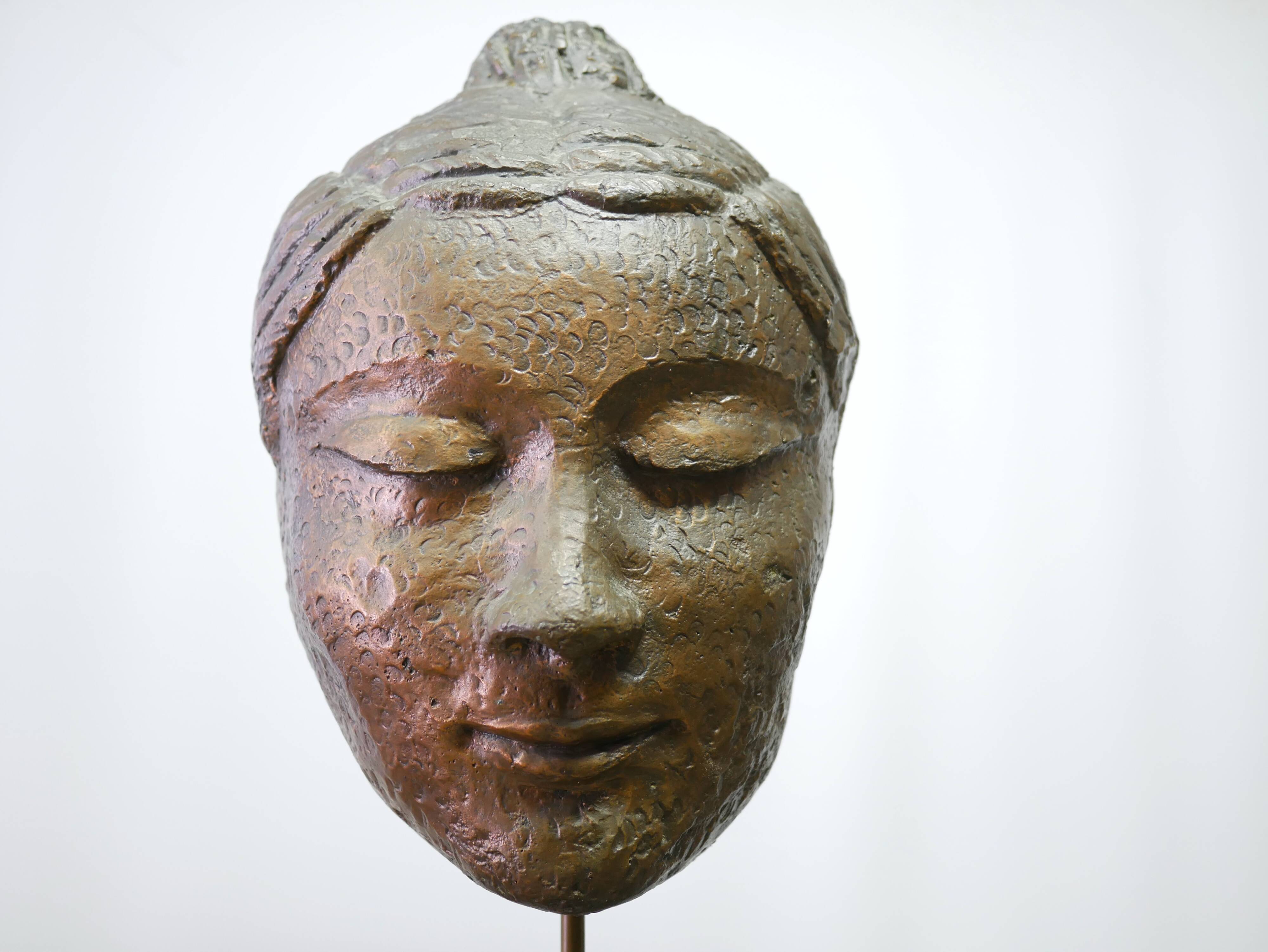Buddha head sculpture, marble base