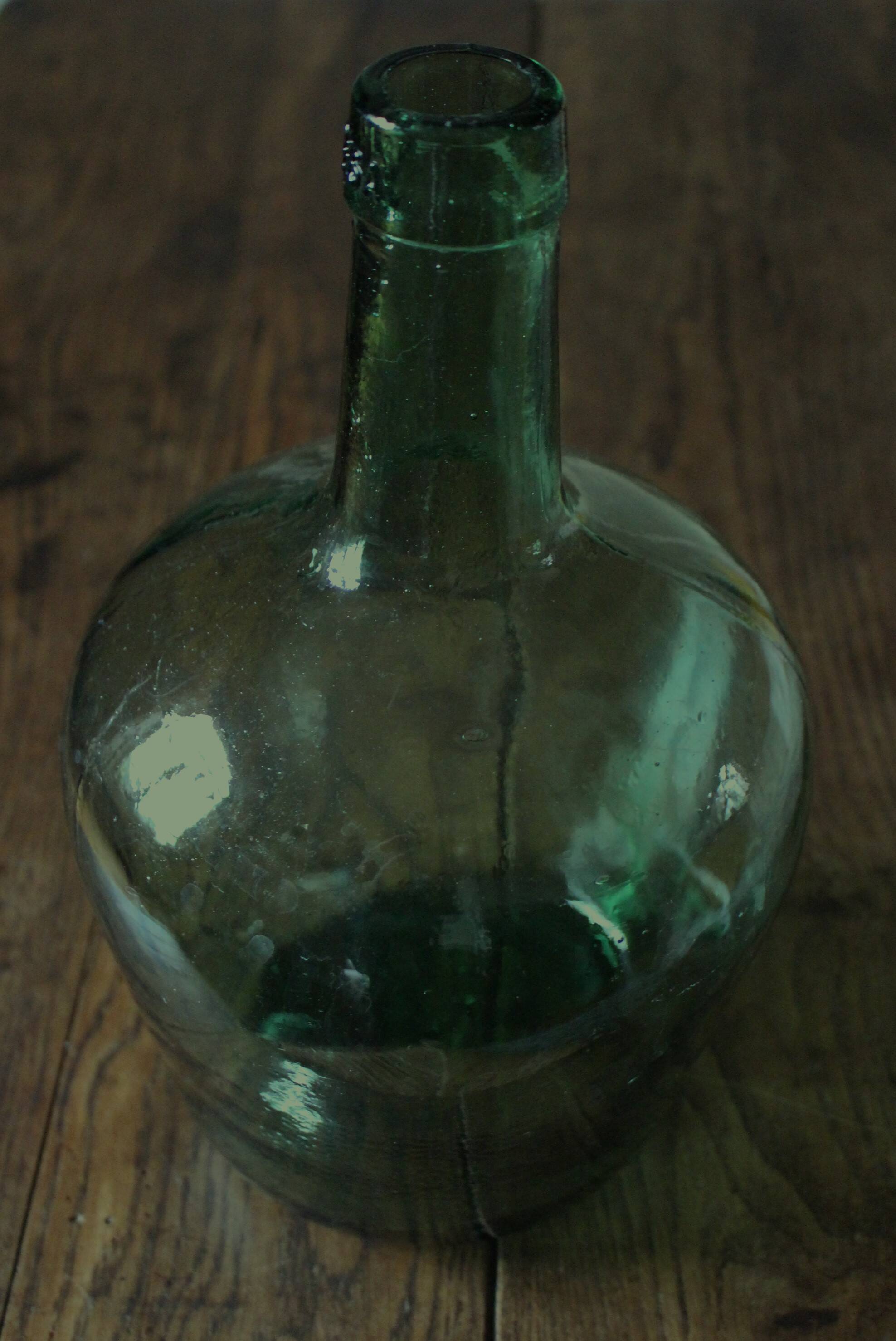 Dame Jeanne carboy from the Viresa Collection in green glass