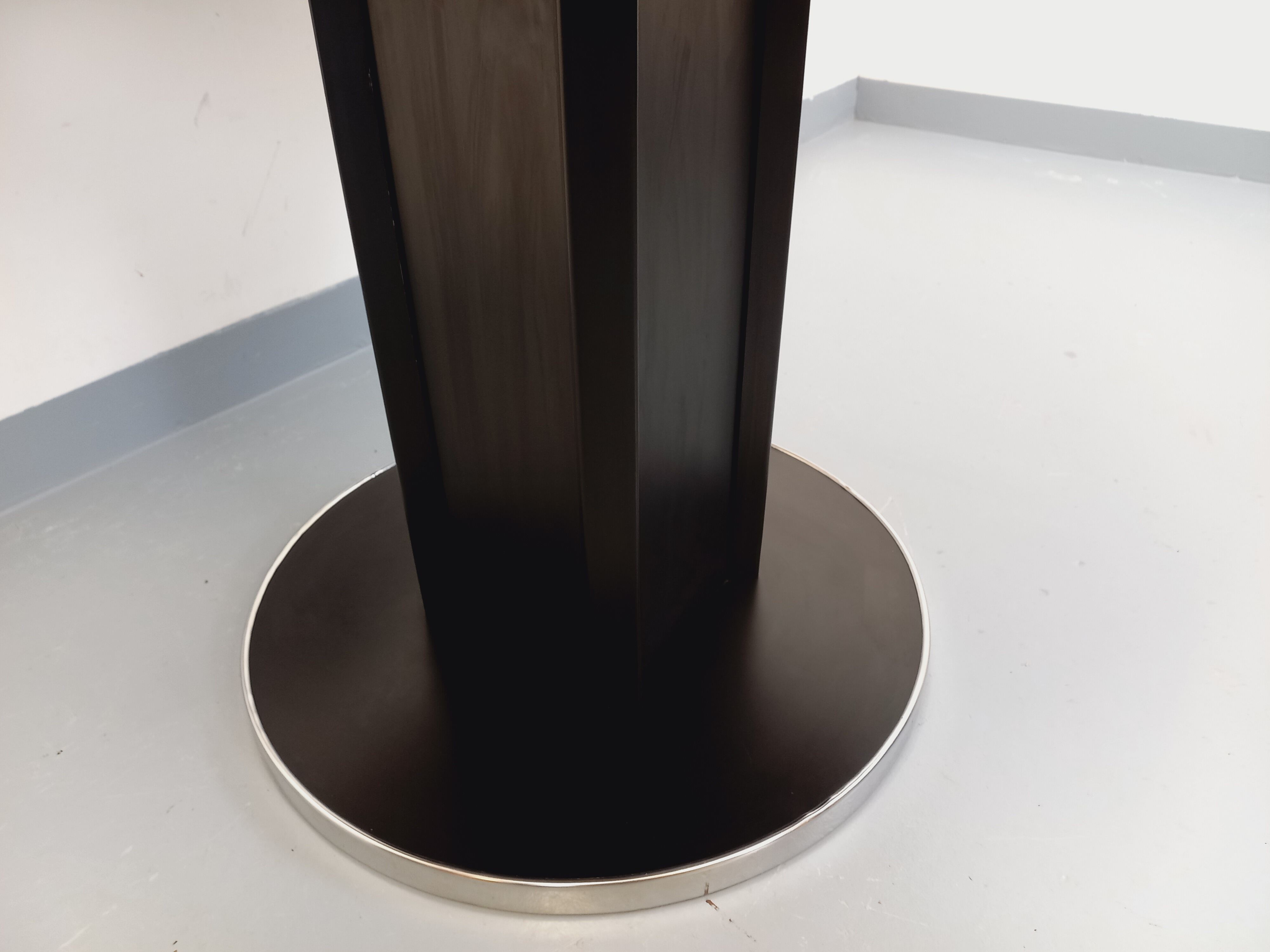 Vintage dining table in melamine with a black wood effect and chrome metal.