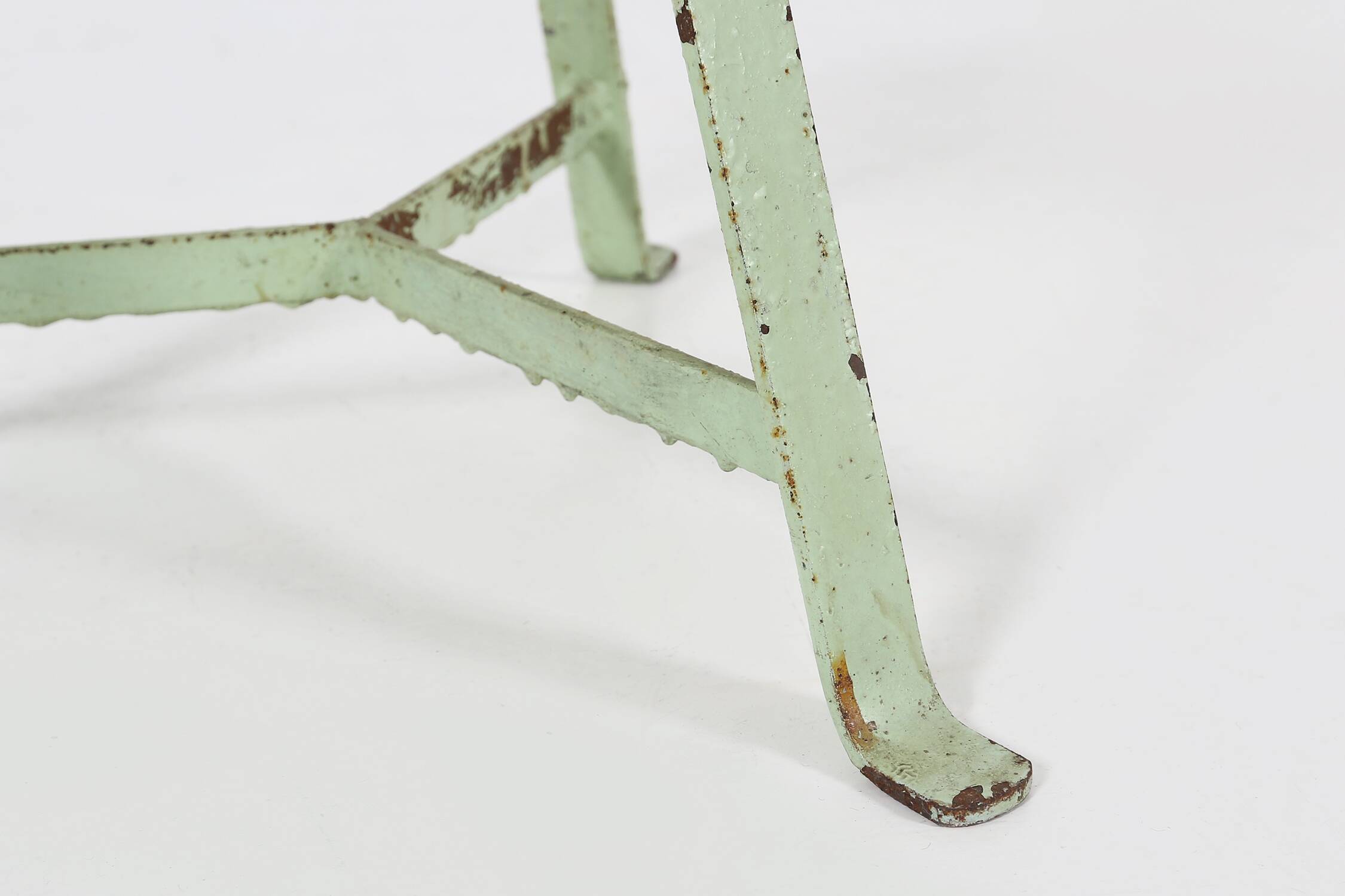 Industrial green painted stool with steel base and wooden top, France 1930s