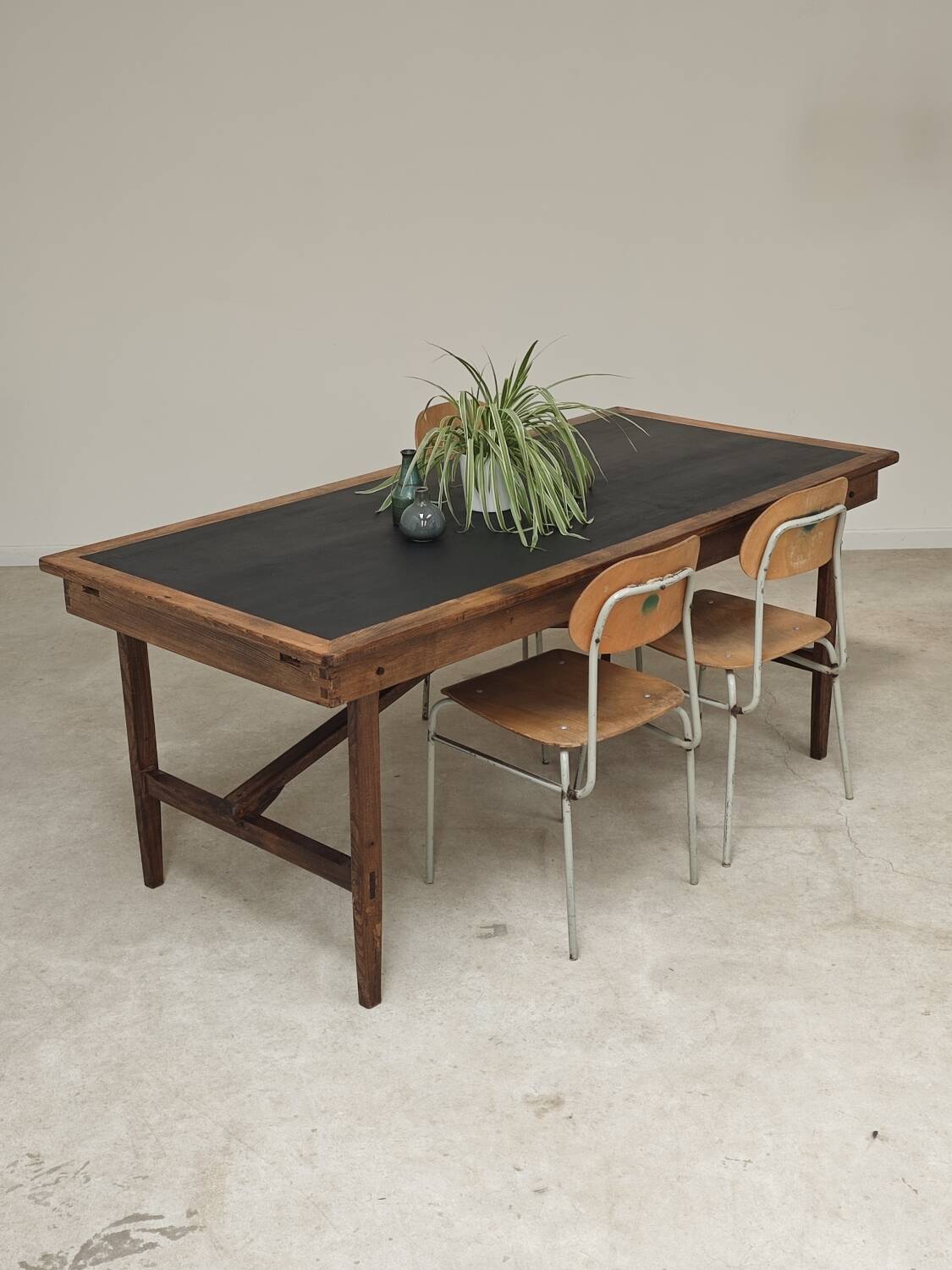 Vintage workshop folding table in oak with a hand-patinated black top.