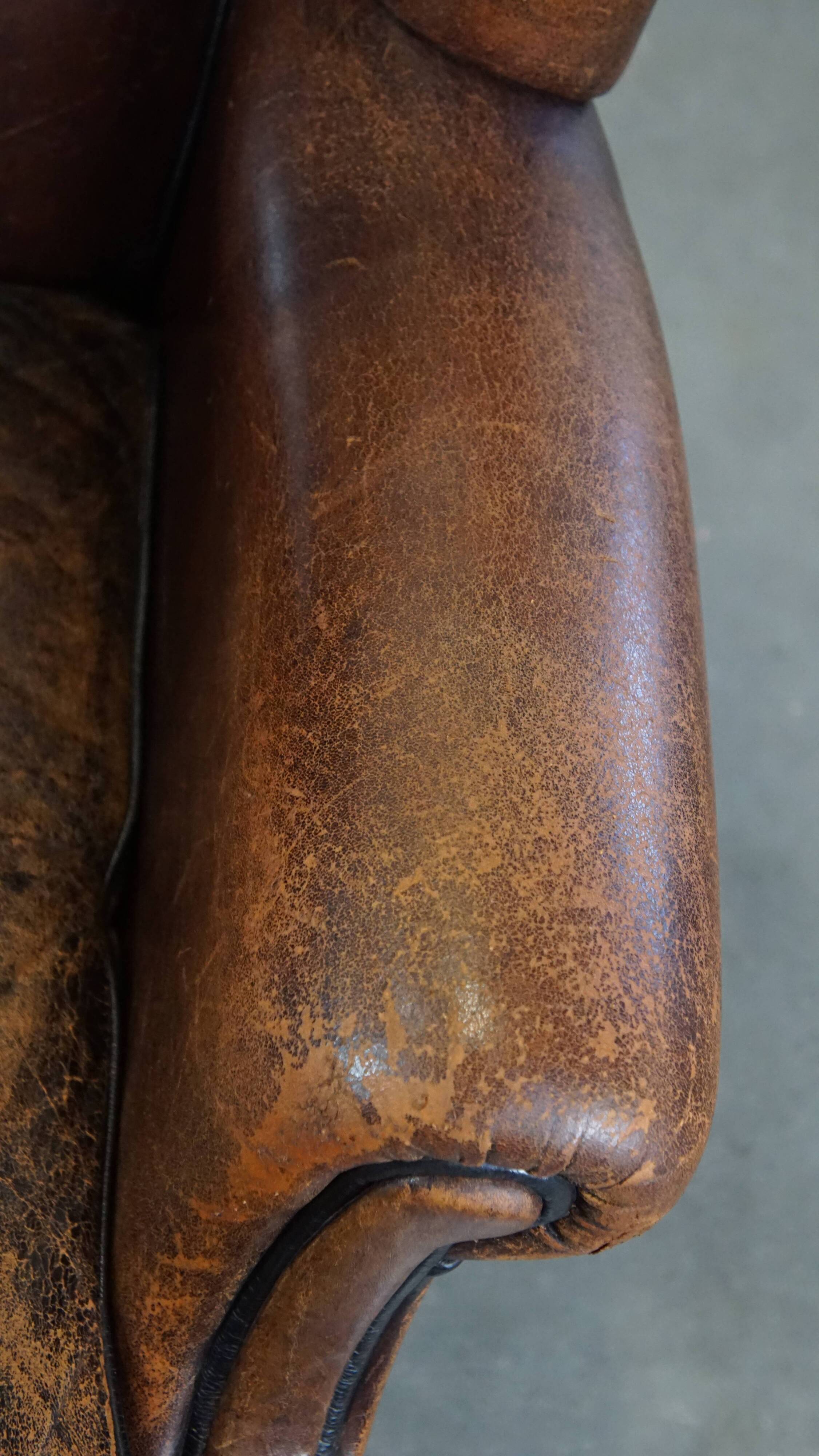 Sheep leather wing chair with patina