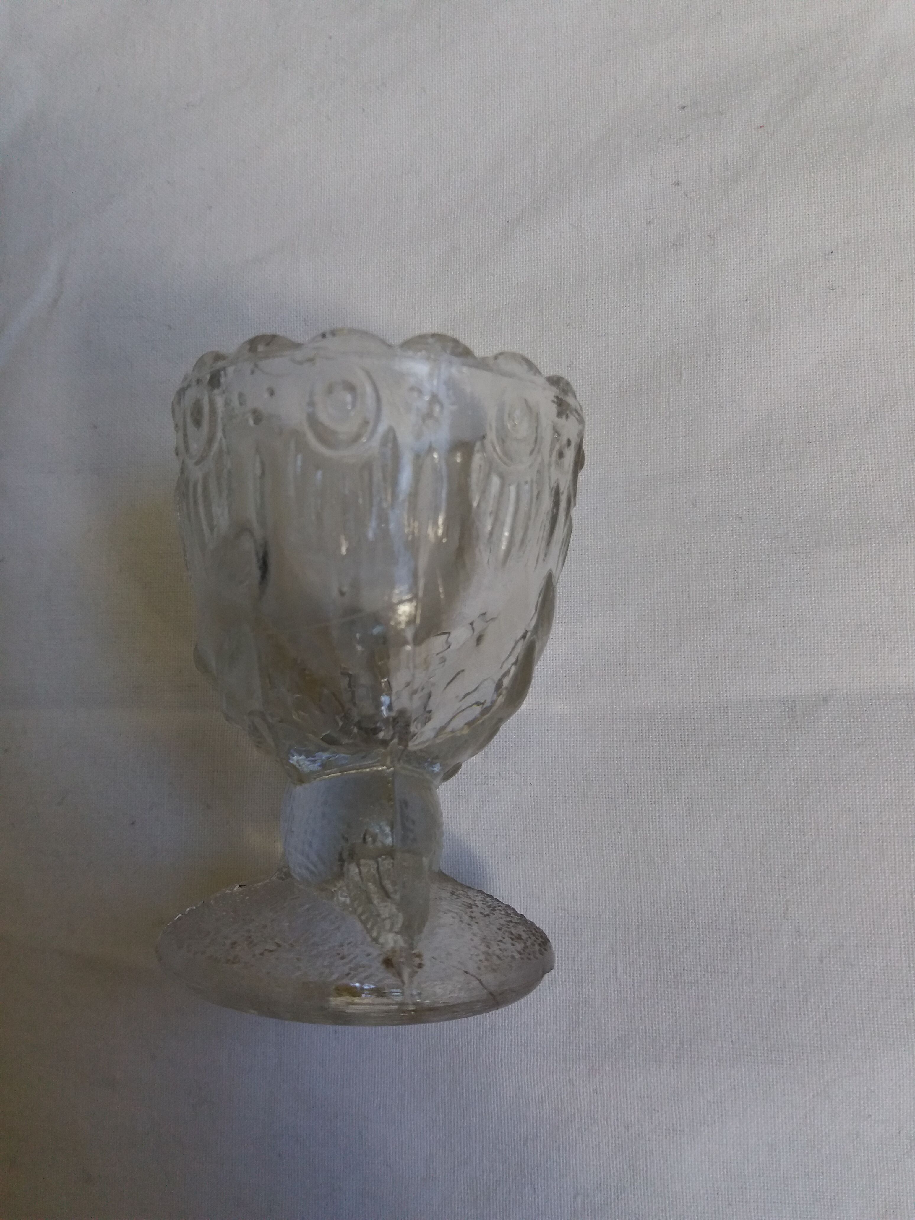 Molded glass egg cup with pigeon bird