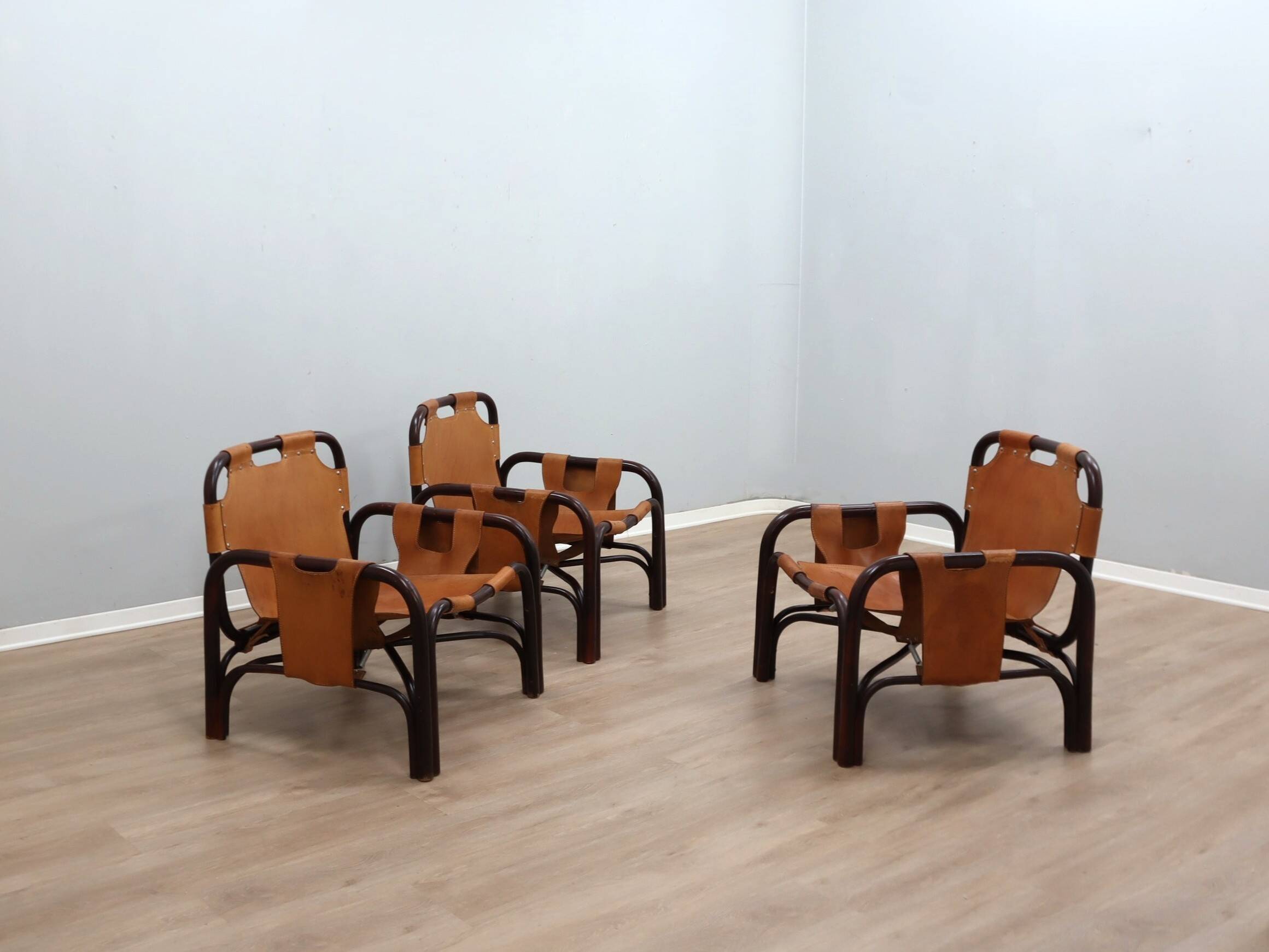A vintage Tito Agnoli armchair leather and bamboo 1960s