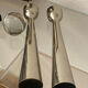 Pair of polished aluminium candlesticks