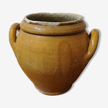 Old yellow glazed terracotta pot