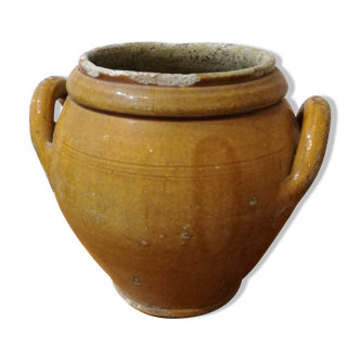 Old yellow glazed terracotta pot