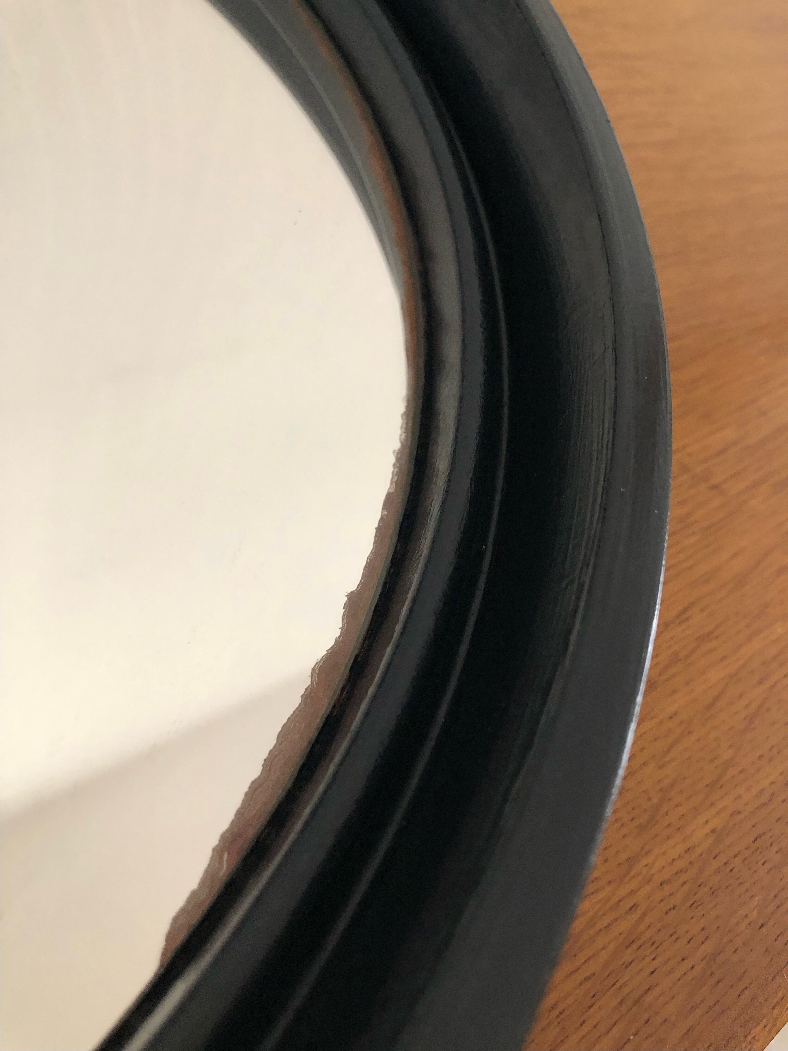 Vintage round mirror in black gilac plastic