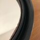 Vintage round mirror in black gilac plastic