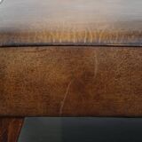 Hocker/coffee table made of sheepskin