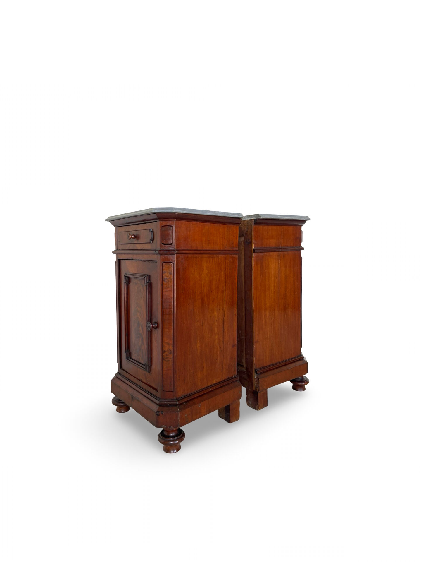 A pair of antique walnut bedside tables from the 1890s.