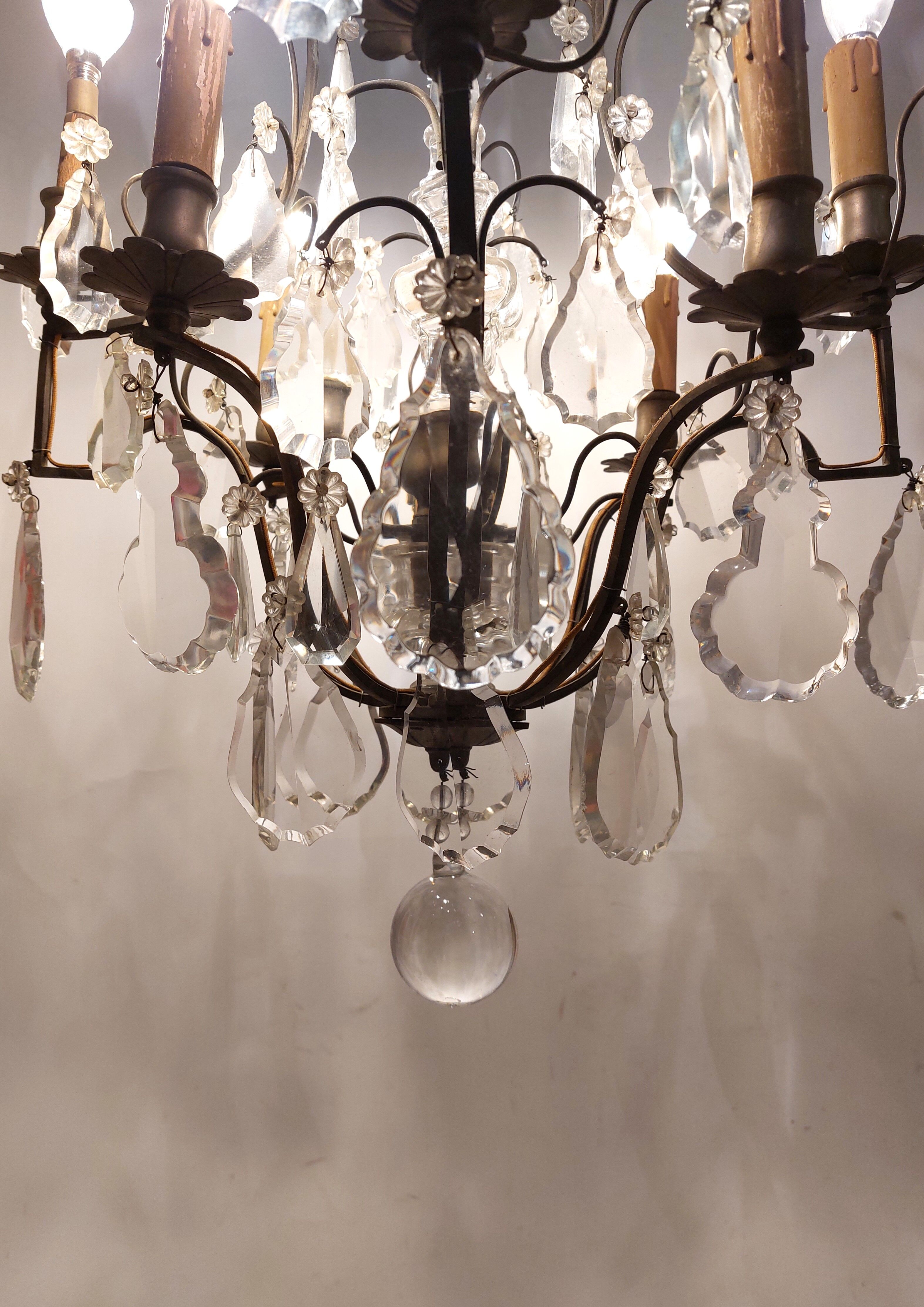 Neoclassical bronze chandelier with 8 lights, tassels and dagger