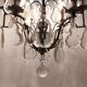 Neoclassical bronze chandelier with 8 lights, tassels and dagger