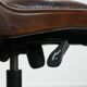 Chesterfield office chair in English style made of cow leather and wood.