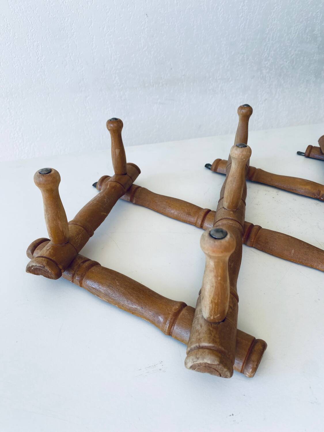 Old wooden wall coat rack