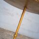 Minimalist brutalist gold metal pedestal table