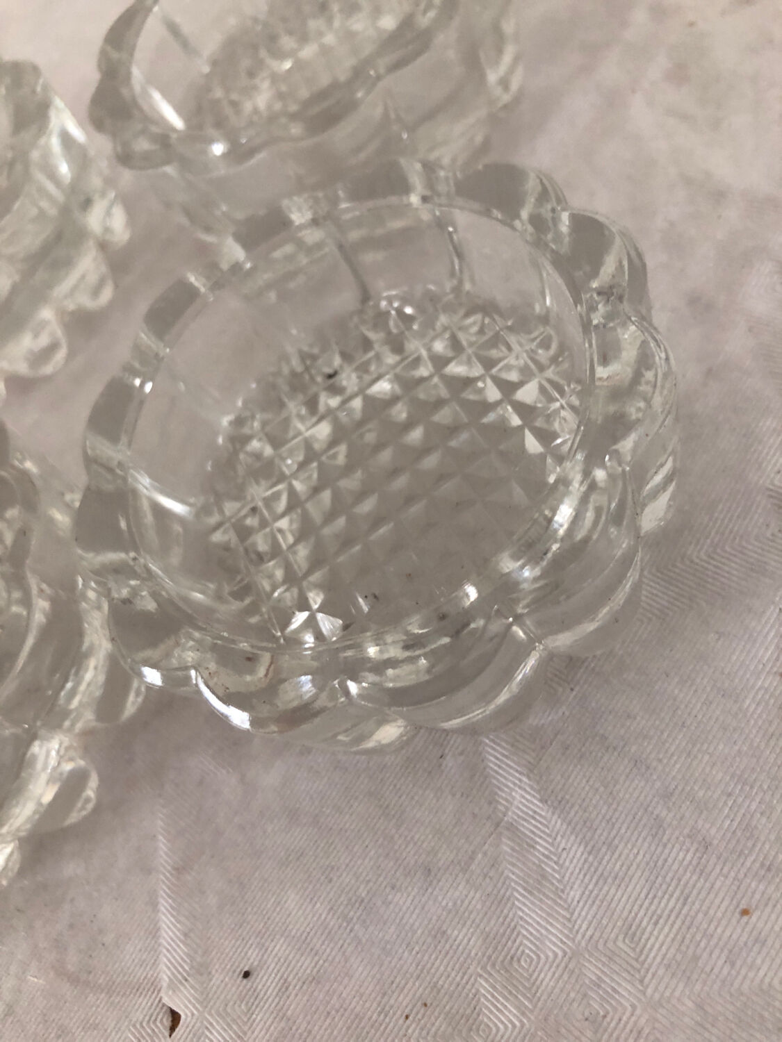 4 flat glass candle holders cut in the shape of Vintage flowers