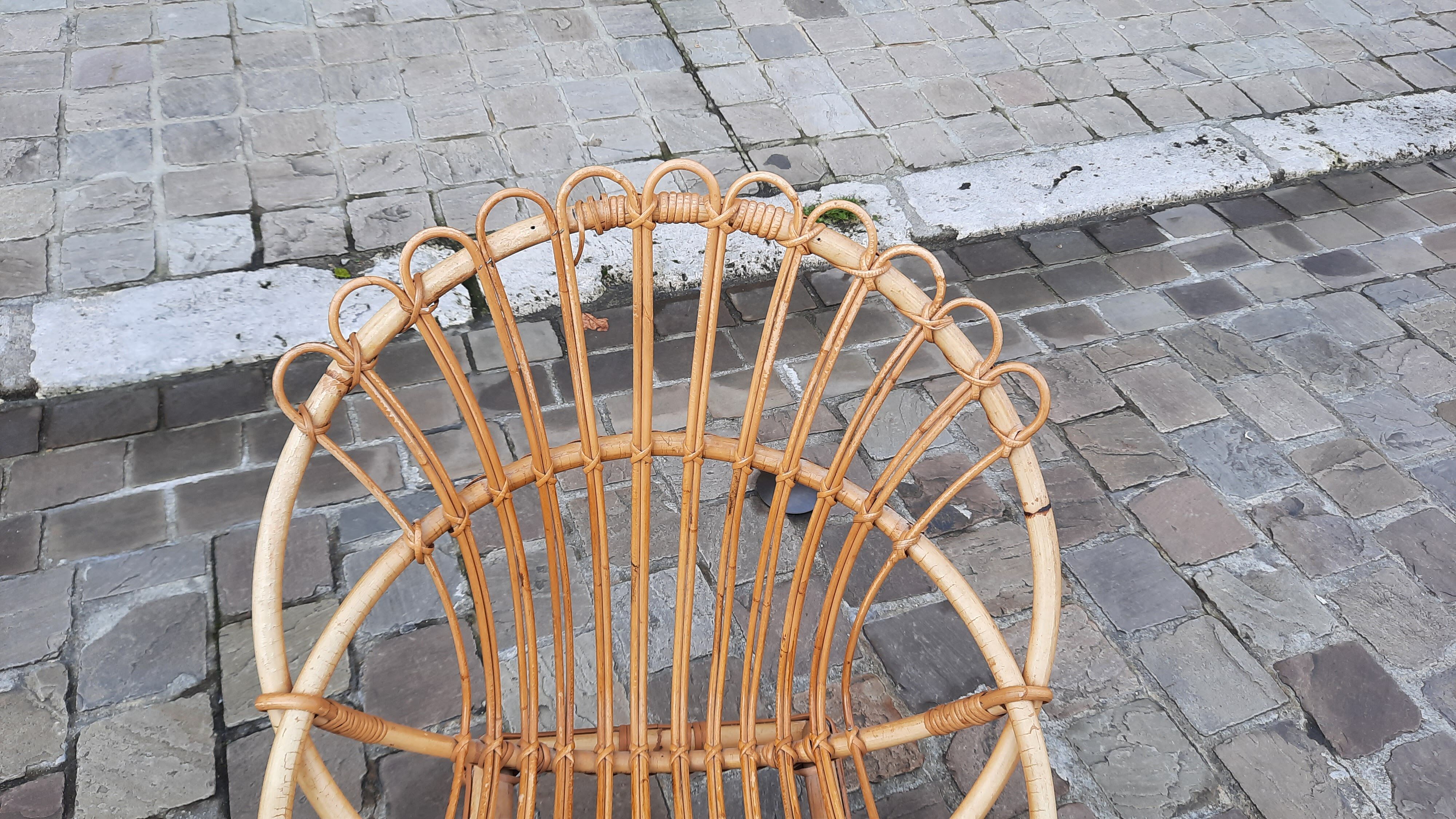 Pairs of shell rattan armchairs from the 50