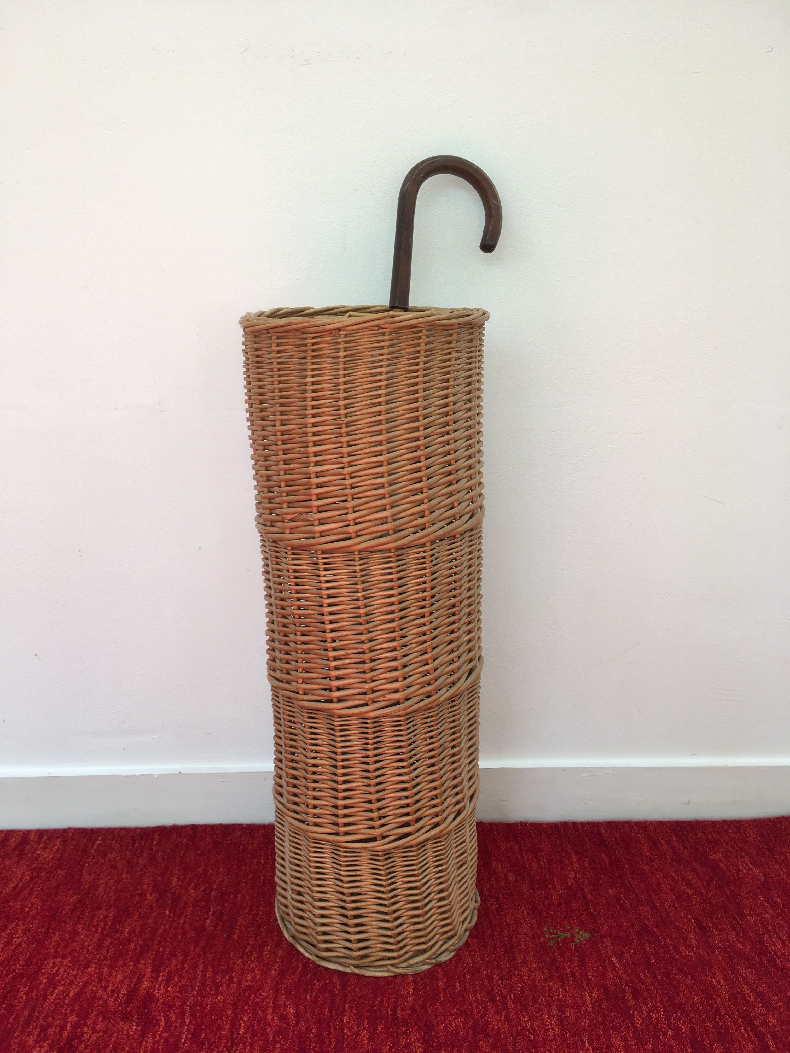 Vintage umbrella holder in wicker rattan