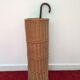 Vintage umbrella holder in wicker rattan