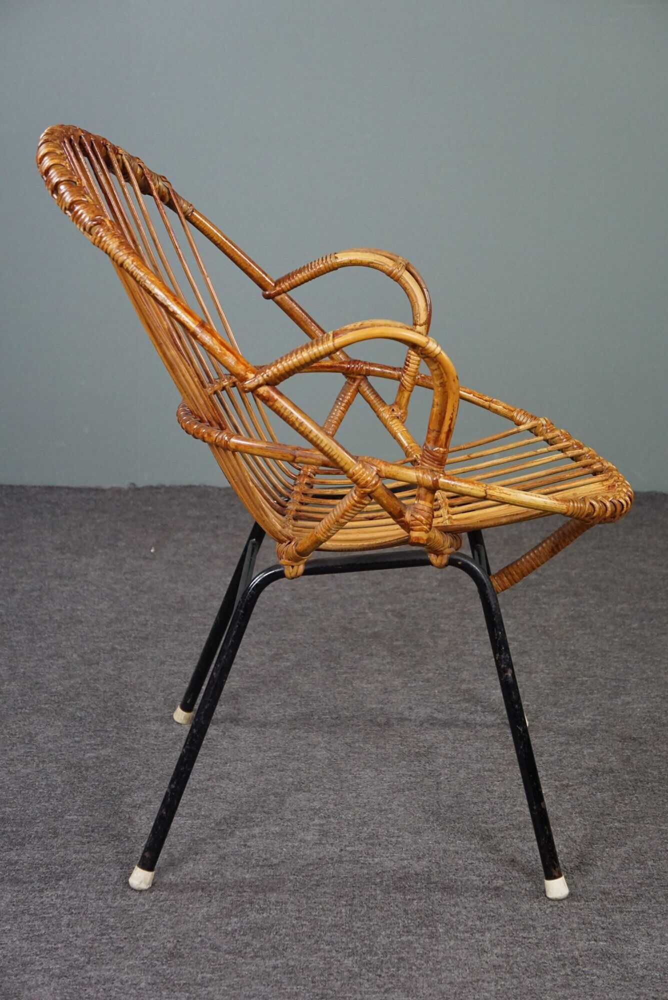 Dark rattan armchair with armrests Dutch Design 1960