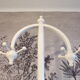 Sputnik parrot coat hanger