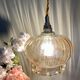 Suspension globe vintage en verre ambré