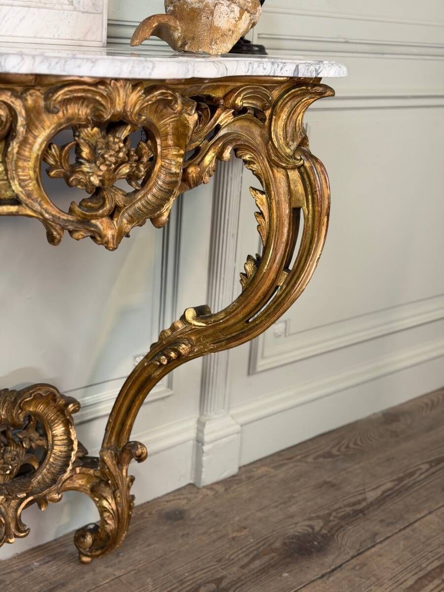 Louis XV style console in carved and gilded wood, circa 1880.