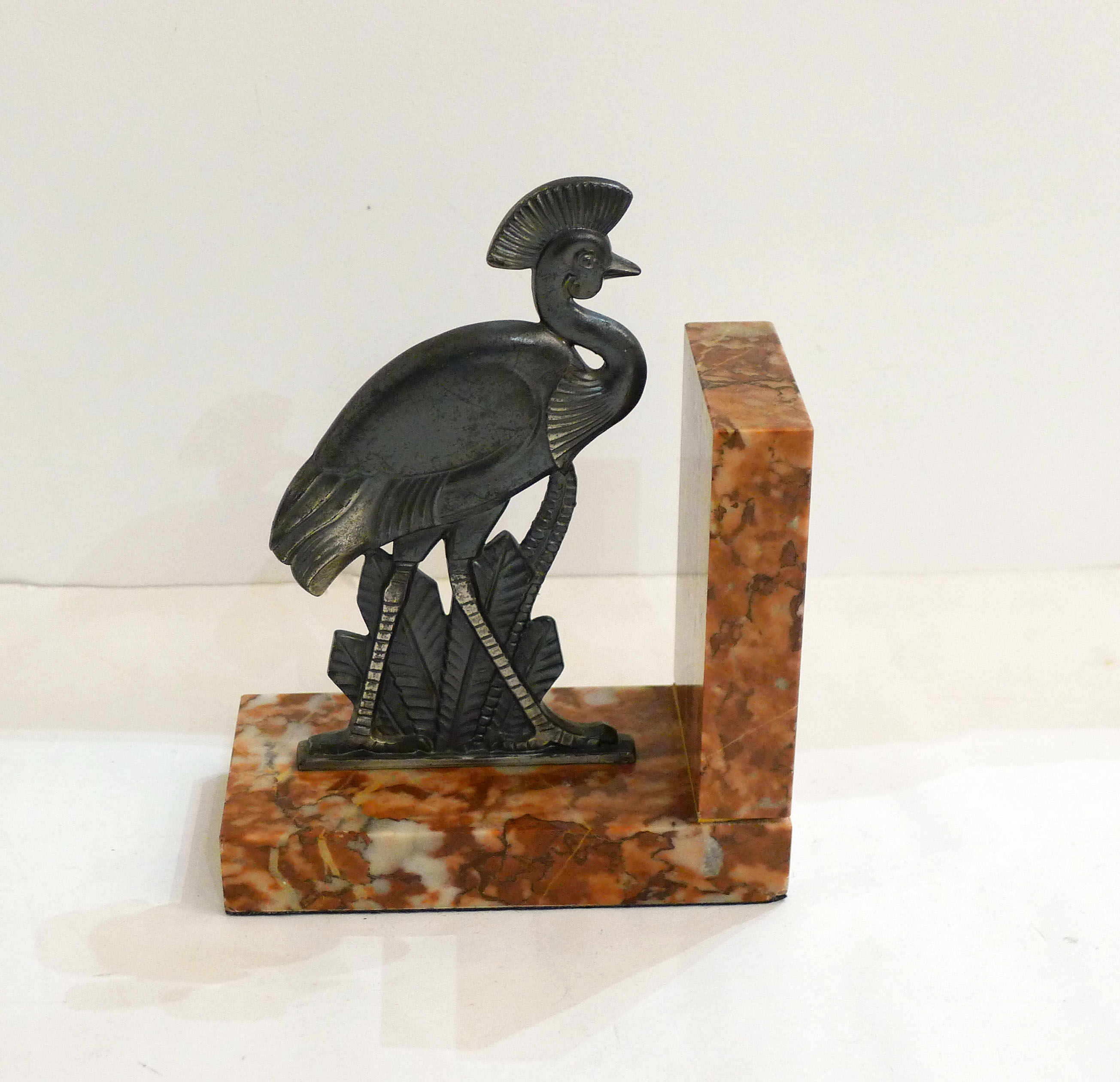 Art Deco bird bookend on marble