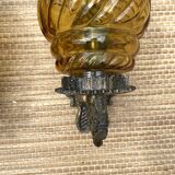 Medieval style metal and amber glass wall lamp